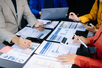 Business people meeting at office writing notes about sticky notes Laptop,tablet  Planning and Brainstorming Strategies