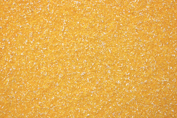 Texture of polenta, yellow cornmeal, top view.