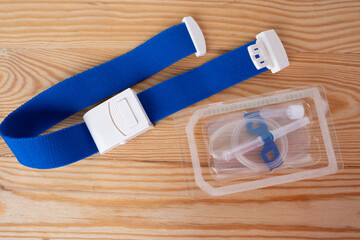 tourniquet and blood collection supplies, highlighting medical tools for diagnostics, needles,...