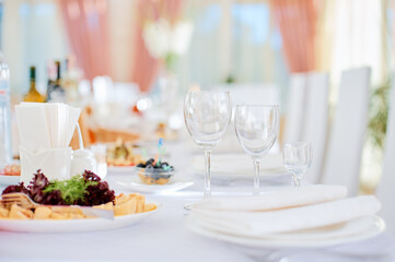 Elegant Table Setting With Glassware and Plates in Bright Atmosphere..