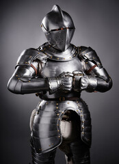 Medieval Knight in Polished Steel Armor on Dark Background..