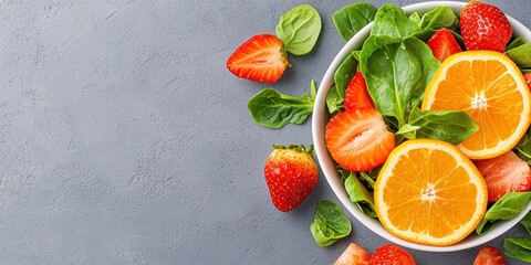Naklejka premium Fresh Spinach Strawberry Orange Salad Bowl