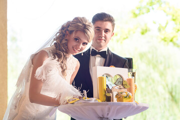 Bride and groom near wedding arch, altar outdoors. summer wedding outdoor ceremony in yellow...