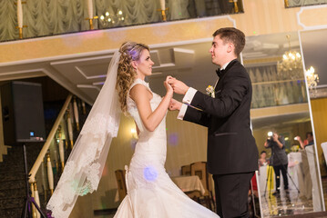 bride and groom dancing first wedding dance at banquet. Romantic tradition at wedding. Heterosexual couple, family traditional values