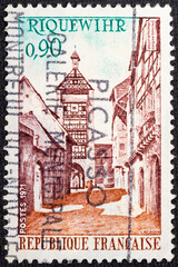 FRANCE - CIRCA 1971: A stamp printed in France shows Tower and street, Riquewihr, circa 1971