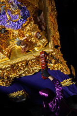 Penitents Participating in Holy Week Religious Procession with Ornate Passion Scene Float