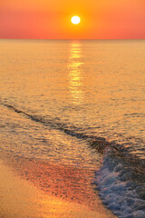Sunrise Over a Calm Ocean Beach