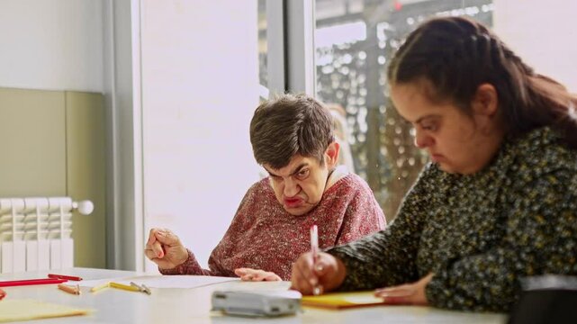 Female residents with mental disabilities engaging in creative activities