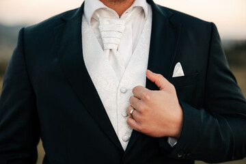 With his tuxedo perfectly tailored and a boutonnière pinned with care, he stands ready — a symbol of timeless elegance, love, and the promise of forever.