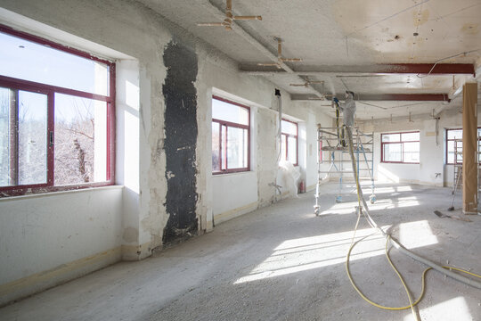 Renovation Progress in a Sunlit Room With Scaffolding