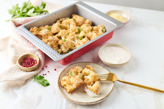 Baked cauliflower with cheese and breadcrumb coating