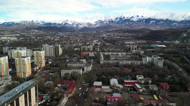 Almaty, Kazakhstan - 04.04.2025 : The river is in the center of the city. Different architecture. The view from the drone. Spring time.
