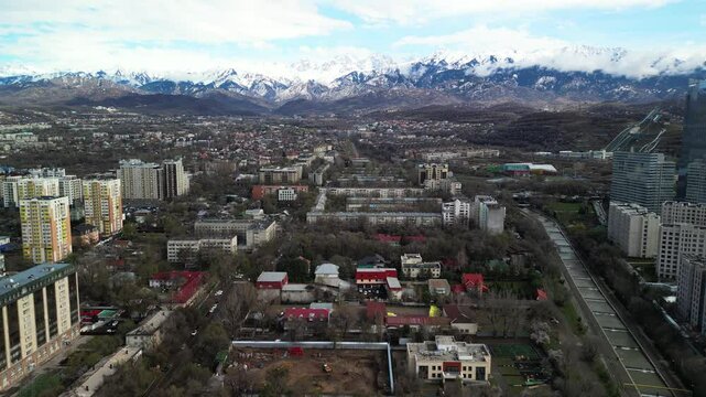 Almaty, Kazakhstan - 04.04.2025 : The river is in the center of the city. Different architecture. The view from the drone. Spring time.