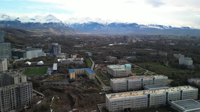 Almaty, Kazakhstan - 04.04.2025 : The river is in the center of the city. Different architecture. The view from the drone. Spring time.