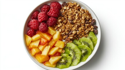 Overhead shot of a vibrant healthy breakfast bowl of fresh mixed fruit, crunchy granola and creamy yogurt neatly arranged on a plain white background with natural light.