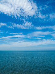 Photography landscape beautiful summer vertical horizon look view shore open sea beach cloud clean and blue sky background calm nature ocean wave water nobody travel at thailand chonburi sun day time