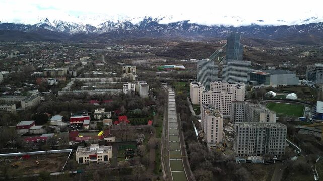 Almaty, Kazakhstan - 04.04.2025 : The river is in the center of the city. Different architecture. The view from the drone. Spring time.