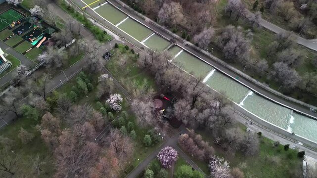 Almaty, Kazakhstan - 04.04.2025 : The river is in the center of the city. Different architecture. The view from the drone. Spring time.