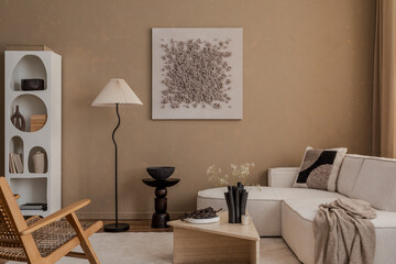 Cozy neutral-toned living room with soft textiles, geometric cushions, and sculptural decor...