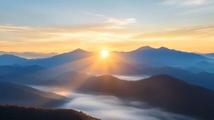 Obraz premium Sunrise over mountain peaks with misty valleys in early morning