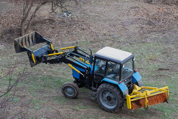 The construction loader is waiting for the next phase of work — a calm before the active phase of landscaping.
