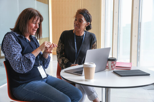 Coworkers�using sign language in office