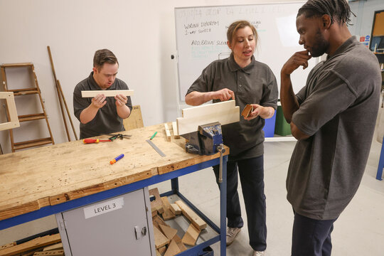 Disabled men and woman at workshop