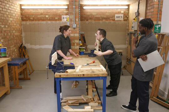 Disabled men and woman at workshop