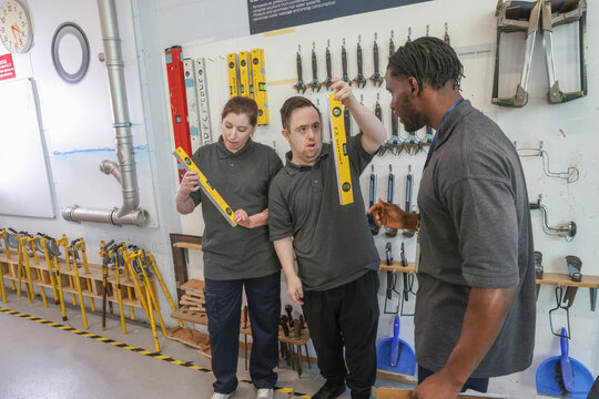 Disabled men and woman at workshop