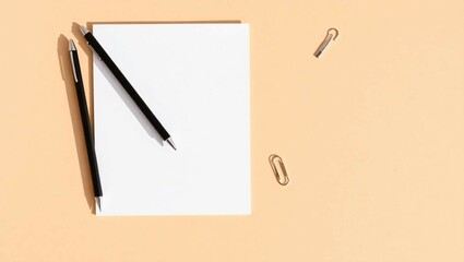 A flat lay background of a clean beige workspace with minimalist stationery items&mdash;pens, paper, clips&mdash;arranged with soft natural shadows for a calm, elegant look.