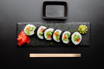 Artfully Presented Sushi Rolls with Wasabi and Soy Sauce