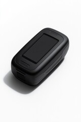 Sleek black device rests on white surface, showcasing minimalist