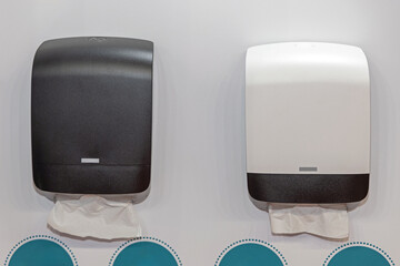 Black and White Plastic Box Hand Paper Towel Dispensers at White Wall