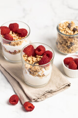 yogurt with granola and raspberries