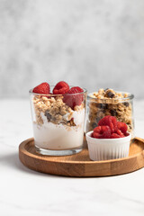 yogurt with granola and raspberries