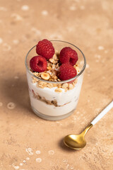 yogurt with granola and raspberries