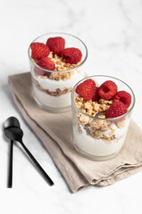 yogurt with granola and raspberries