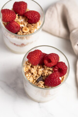 yogurt with granola and raspberries