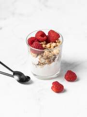 yogurt with granola and raspberries, breakfast