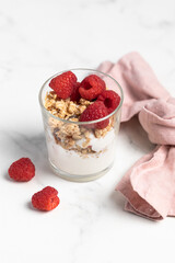 yogurt with granola and raspberries, breakfast