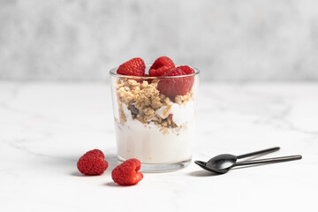 yogurt with granola and raspberries, breakfast