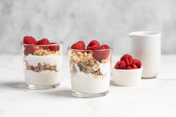 yogurt with granola and raspberries, breakfast