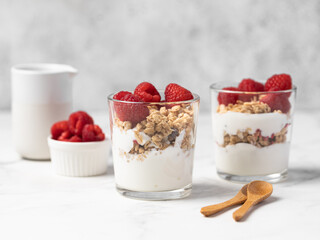 yogurt with granola and raspberries, breakfast