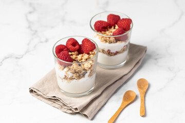 yogurt with granola and raspberries, breakfast