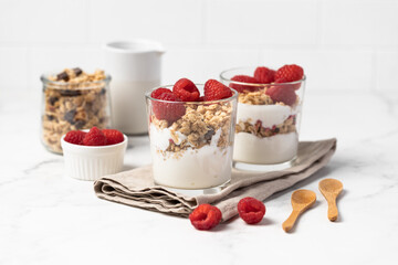 yogurt with granola and raspberries, breakfast