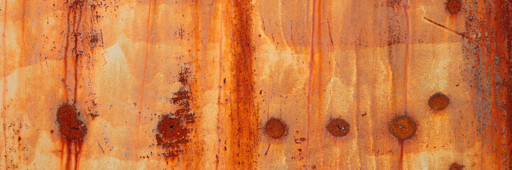 Old rusty metal texture. Rust on the surface of the iron wall. Panoramic background for grunge...