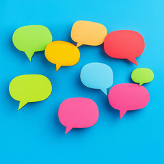 several speech bubbles in different colors on a blue background. icons and remarks. Free space for text or image. Concept of online communication or communications