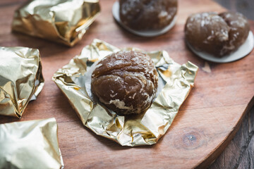 Homemade Marron Glacé on Wooden Background – Sweet Chestnut Dessert