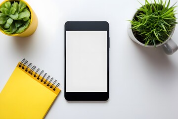 Flatlay Smartphone Mockup with Blank Screen, Yellow Notepad, and Plants