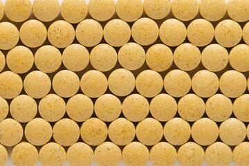 top view of Round yellow tablets pills 